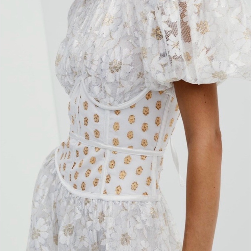 Love & Lemons Lupita Mini Dress in white and gold.